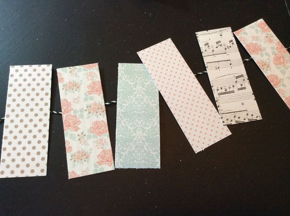 Now we'll craft the 'advice' banner... Cut 6- 1.5"x4" pattern paper pieces.