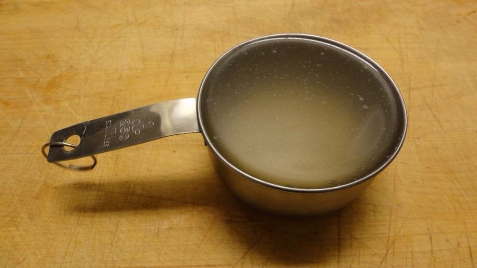 Now, we need to add the chicken broth. If you're animal-conscious, you can use water or veggie broth, but I must admit it tastes better with the chicken one.
