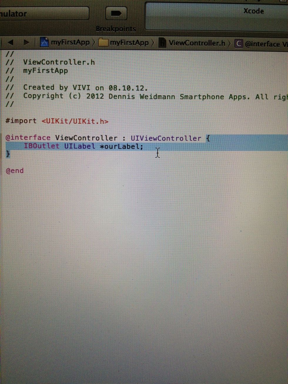 Now we need to declear our Label in the .h File by giving it a name. So click once in the left menu on ViewController.h. Now you add the Code which is selected on the Screen above...