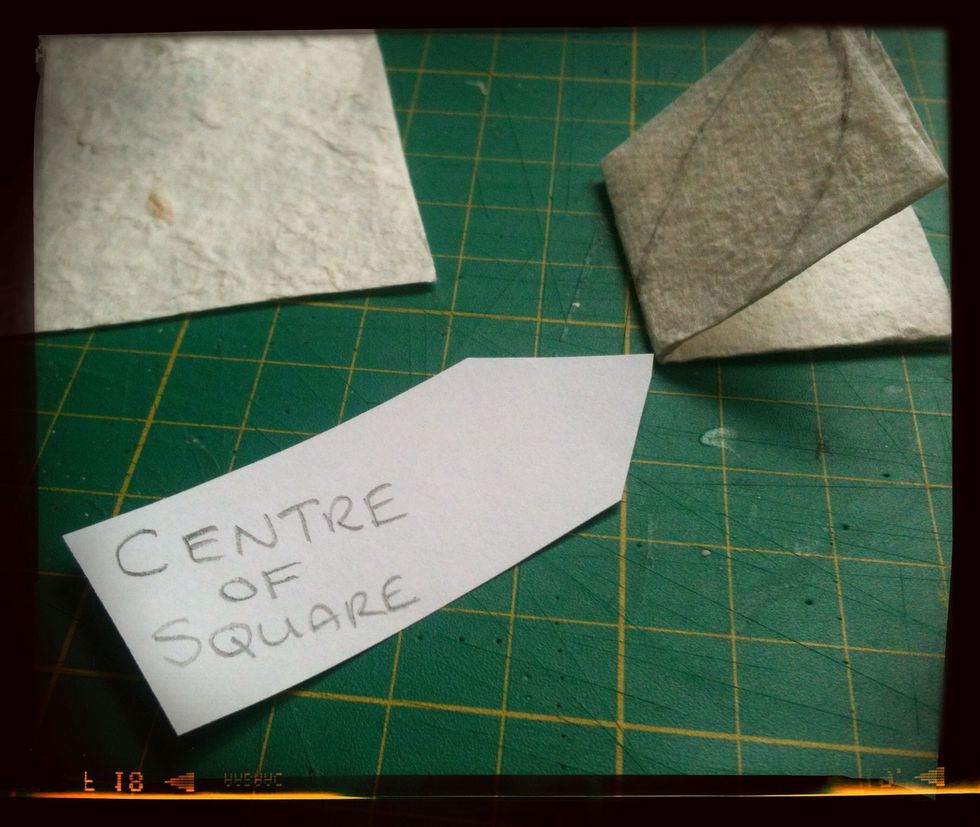 Now we need to find the centre (English Spelling) of the square,  it's where all the folds meet, there should be NO open ends.