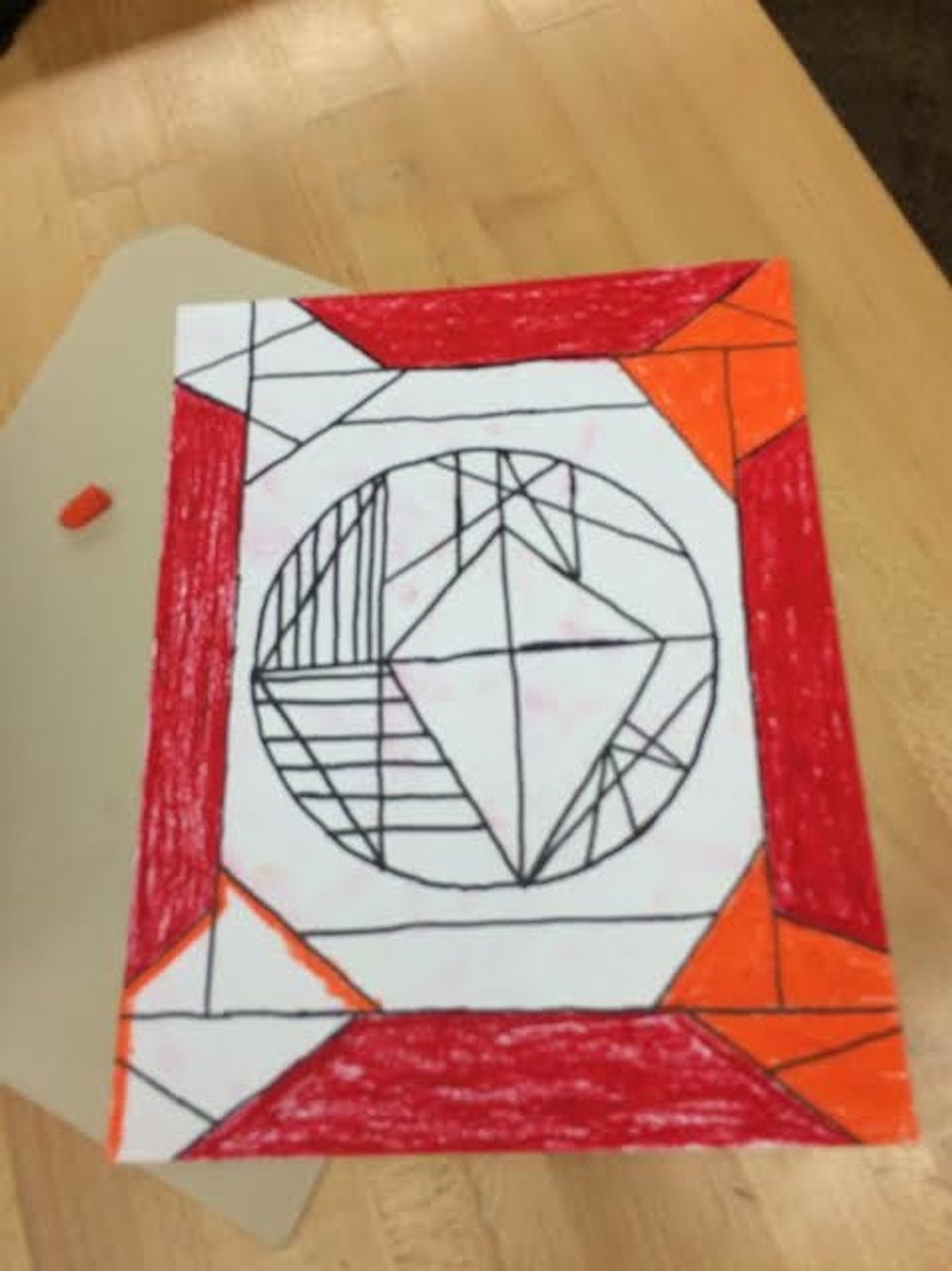 Now we start getting to the colorful part. This is where we start using oil pastels to give the piece lots of flair. The colors I used represented warm colors in this picture.