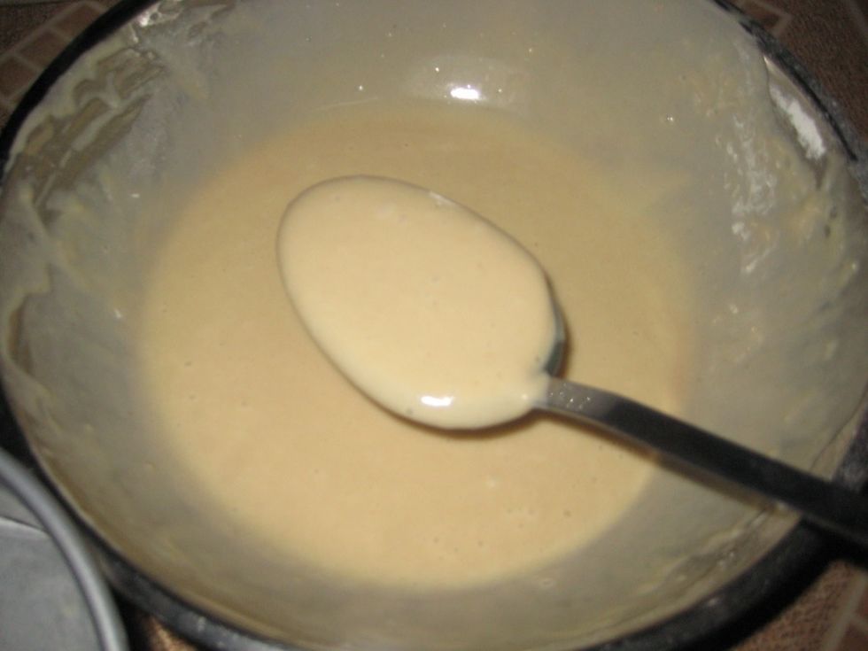 Now we start pouring into the baking tin. Scoop using a large spoon.