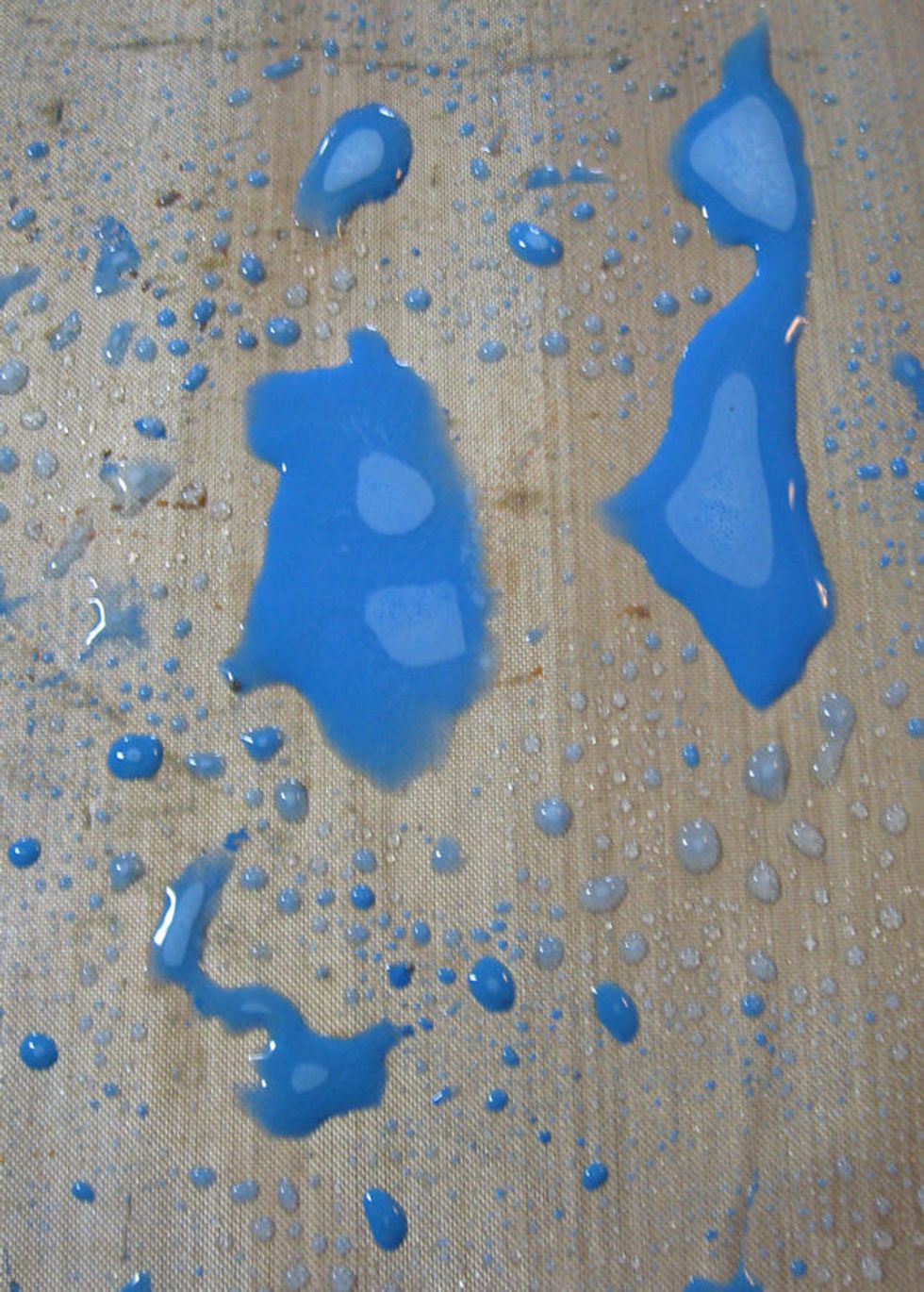 Now we will color our ribbon.  Place a small dot of Broken China on craft sheet.  Dilute with water.  Cut a long piece (about a yard or so) of rayon seam binding and sop up the paint.