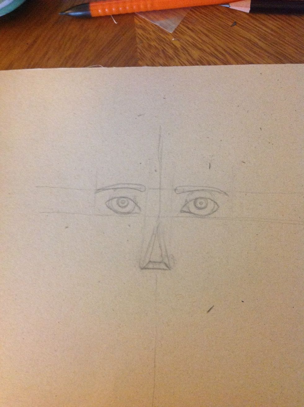 Now we will make the nose. Draw a line in the triangle as you can see in the picture.