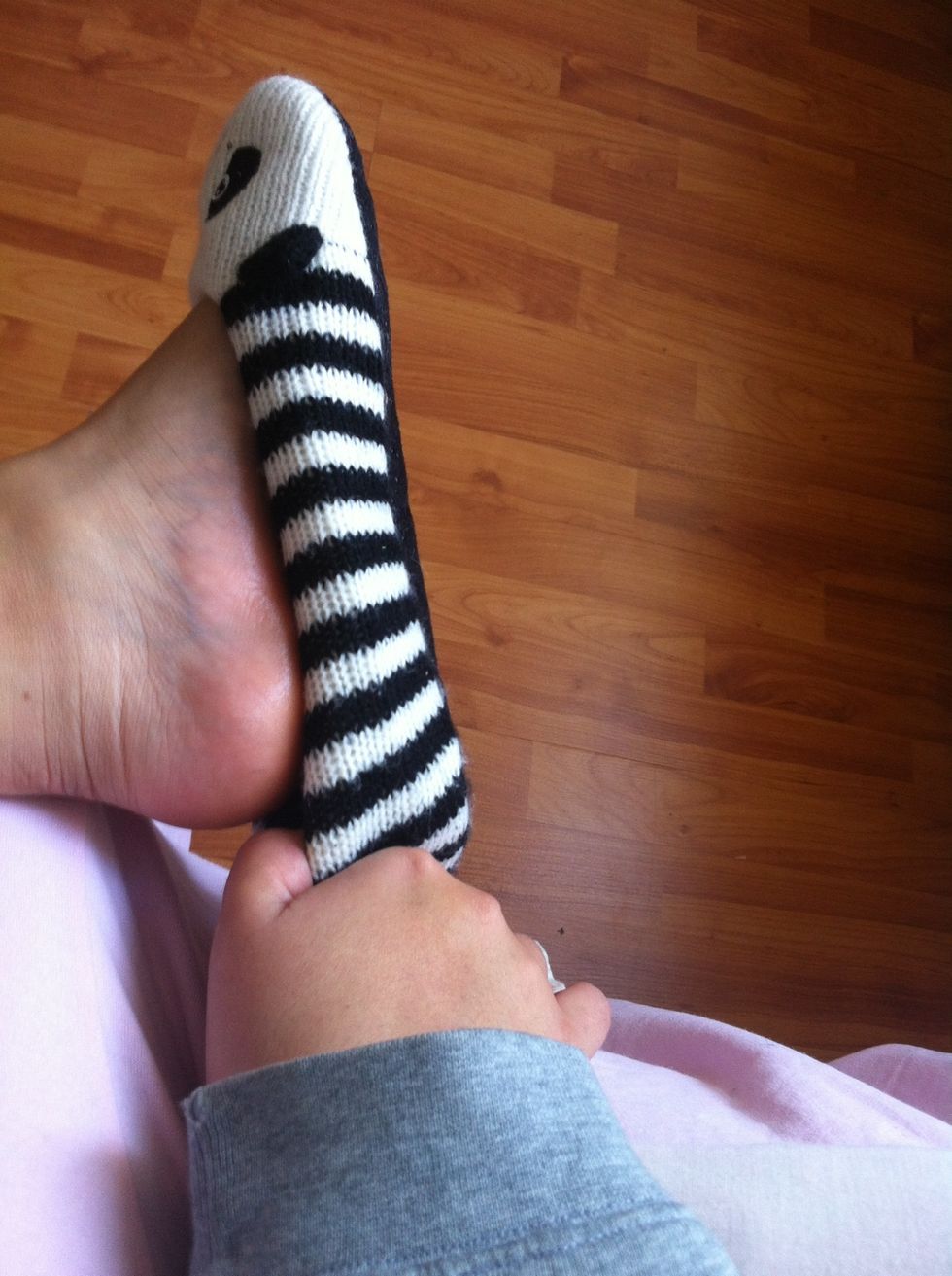 Now, wear your socks or sockets on both o your feet. This will help the Chest Rub to stay on your foot and keep it warm.