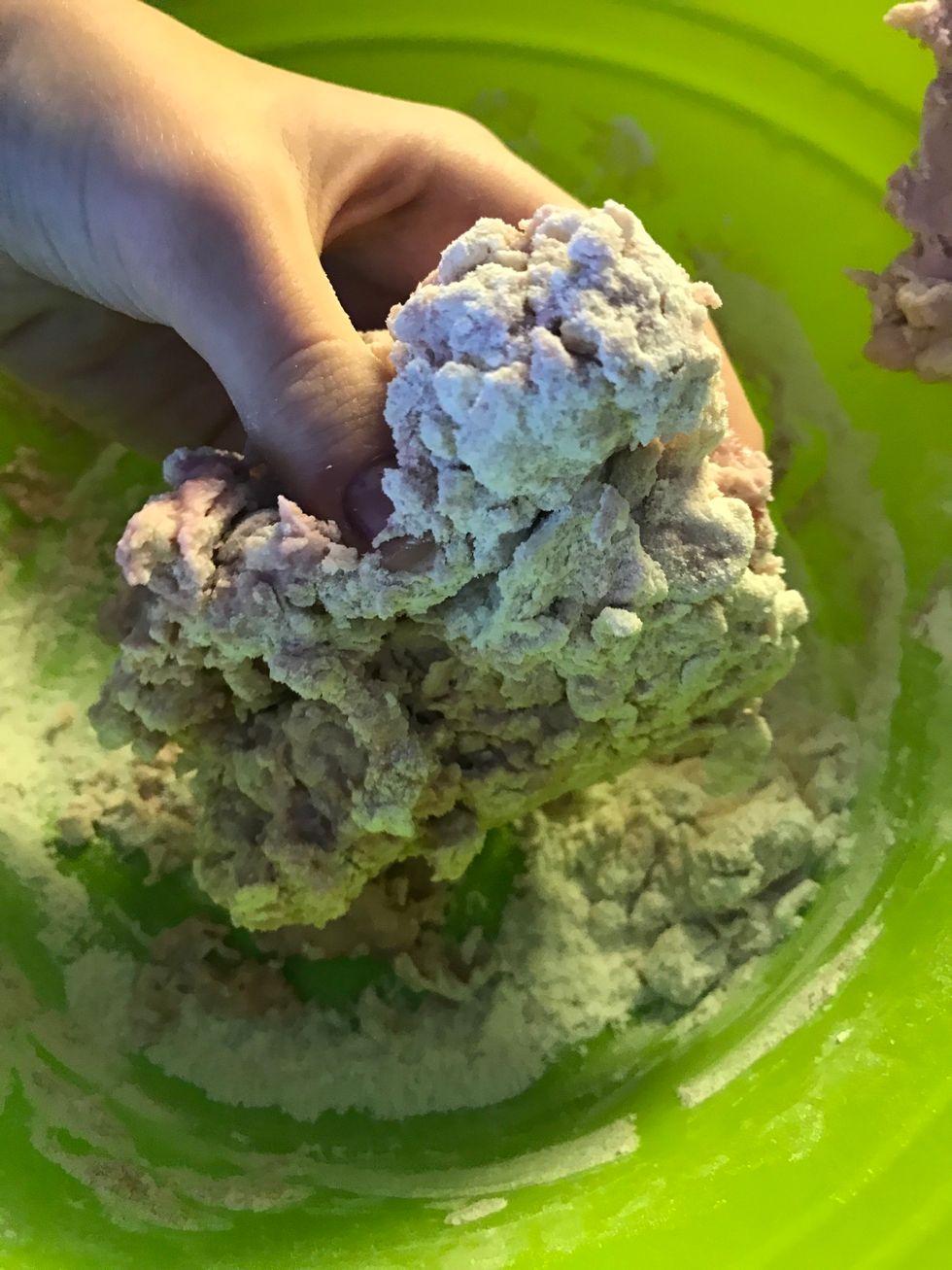 Now when it starts clumping grab it with your hands and start meeding it.