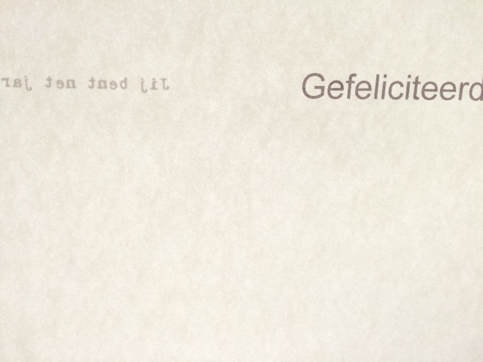 Now when you hold your cardstock up to the light, you\u2019ll see both texts, one is facing you while the other is on the other side of the paper