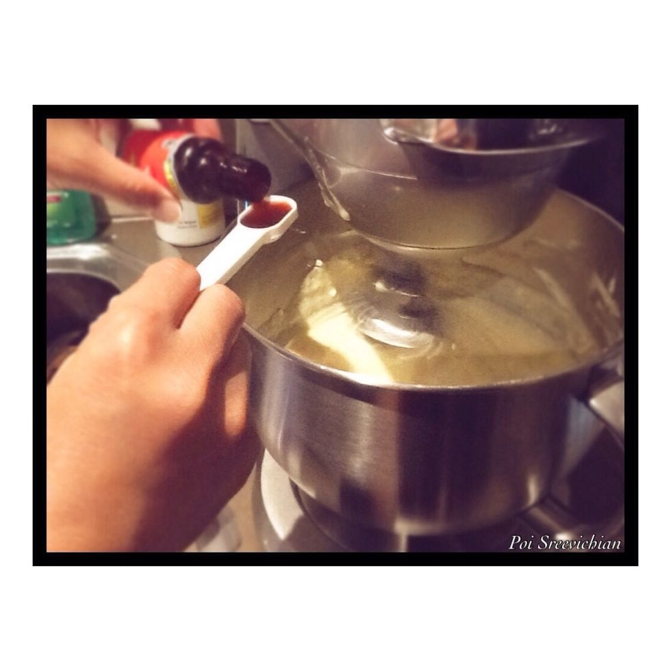 Now when your mixture is hot put it in your electric mixer and start mixing and pour 1 teaspoon of vanilla while it's mixing