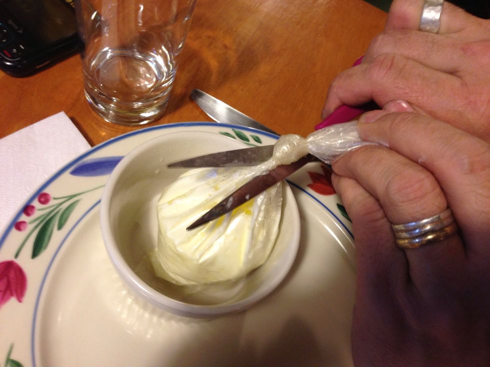 Now, where's that ramkin? Plop the eggs into the dish. Cut off the knot, and pull the bag out, letting everything slide into the dish.