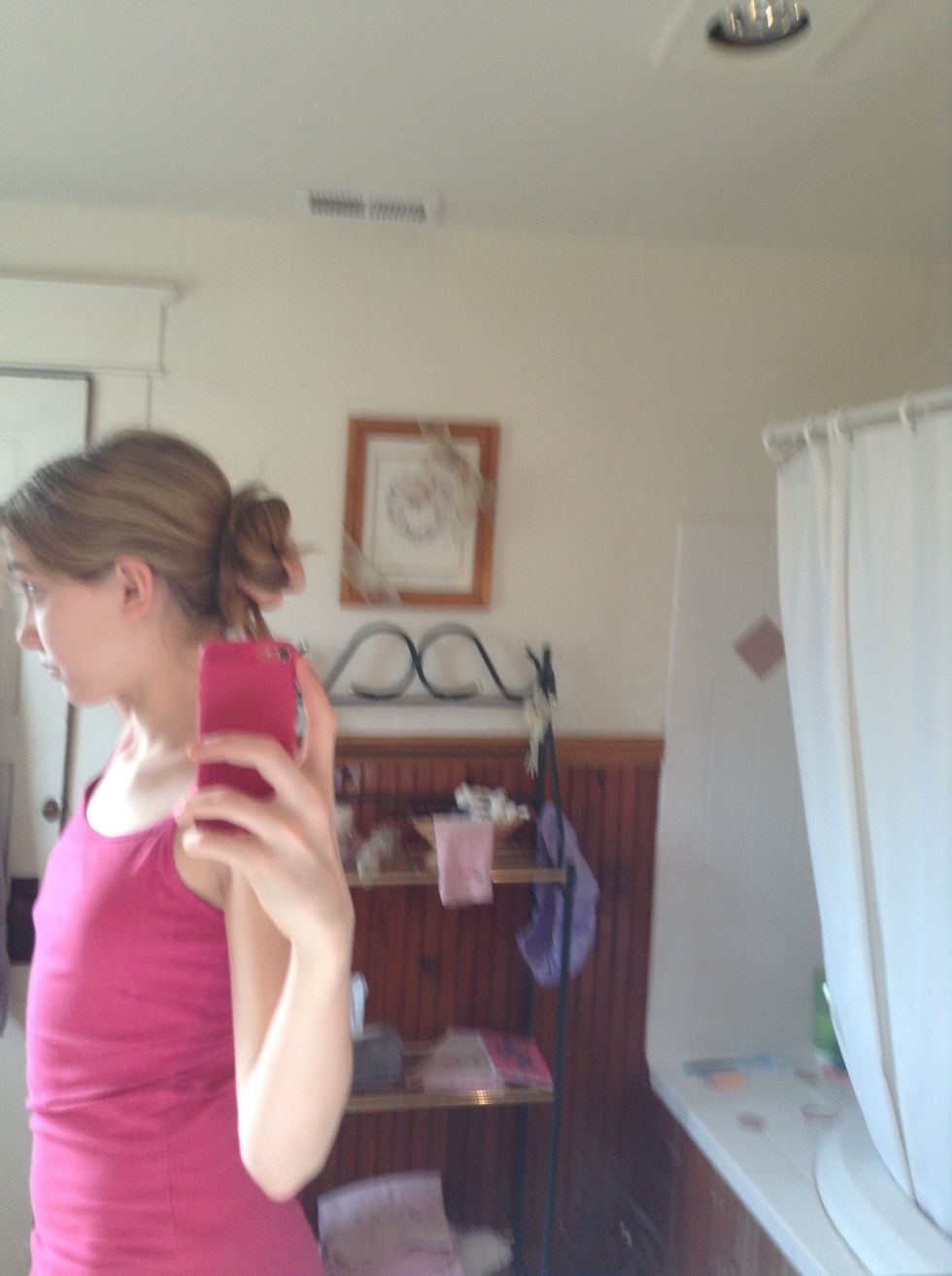 Now, while keeping the pieces twisted, wrap them around your ponytail either way you want.