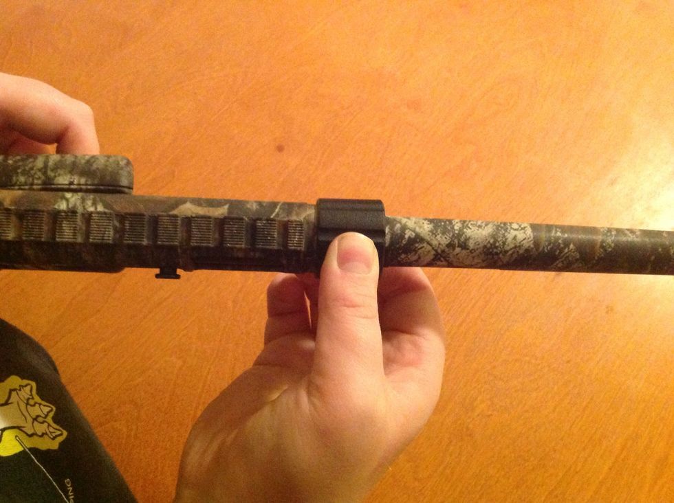 Now while pushing the barrel against the receiver take the plastic ring on the barrel and slide it down on the threaded part of the receiver and screw it together.