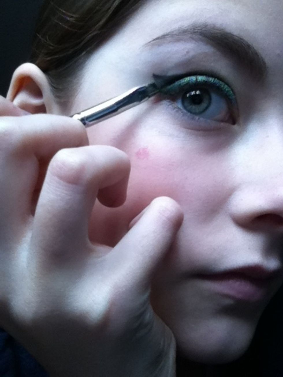 Now wing the black out with an angled eye brush.