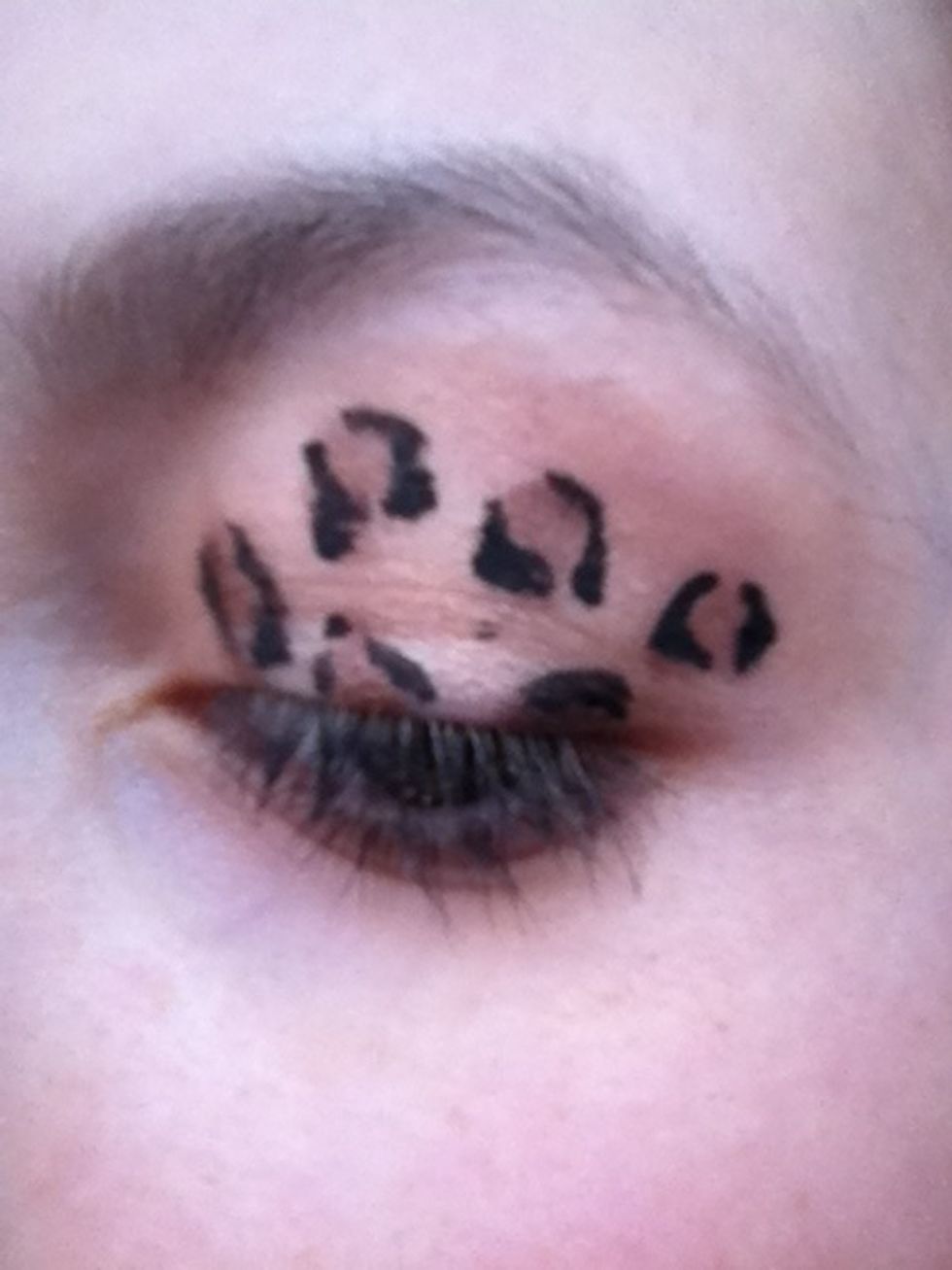 Now with a black liquid eyeliner, roughy line the sides of the spots, but not lining all the way around them.