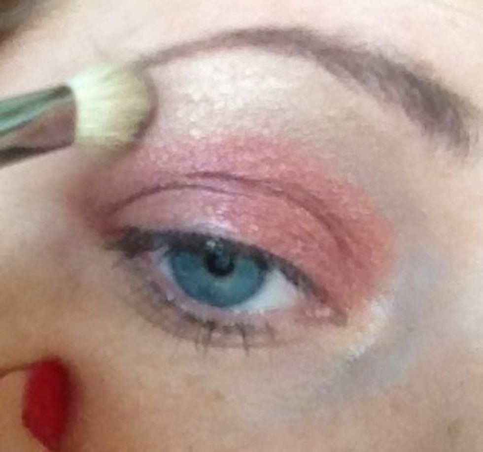 Now with my fave fluffy mac blender brush I'm adding a shimmer biscuit toned pigment into the brow bone and the brick red shadow I am blending the two together to remove harsh lines.