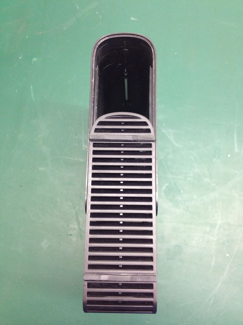 Now with one hand on the front of the outer sleeve and the other on the rear of the chassis pull the two parts away from one another.