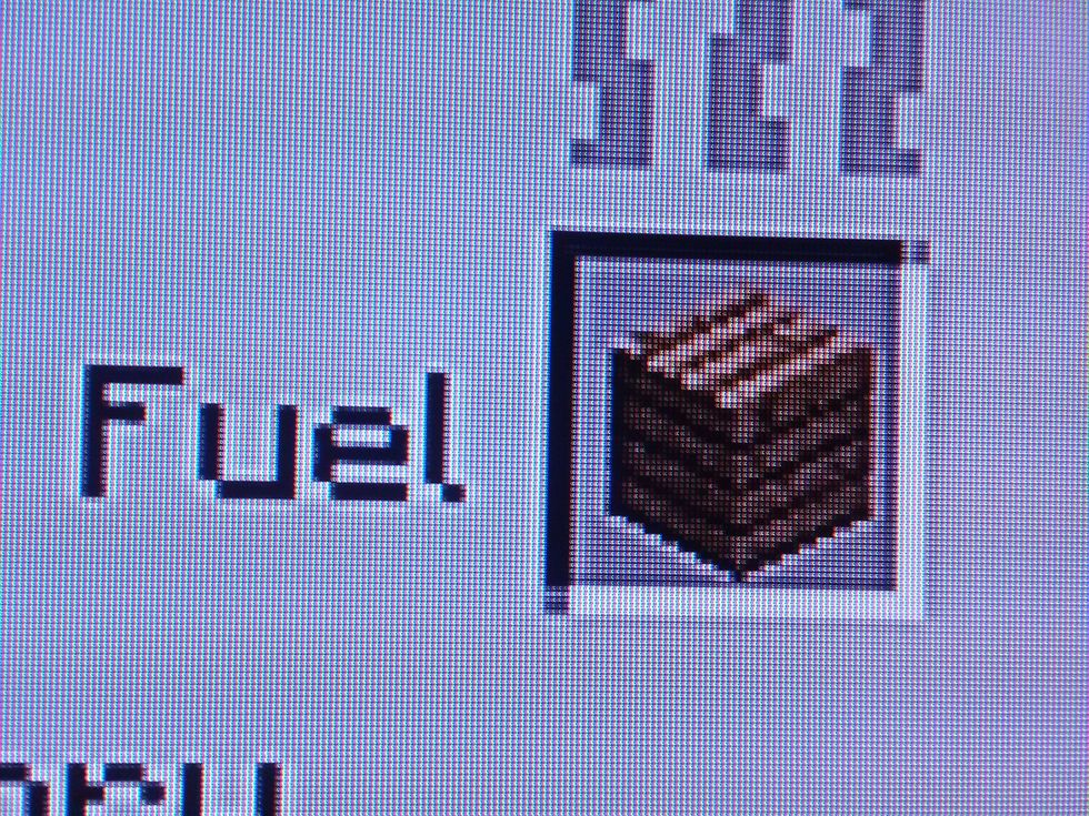 Now with that 1 oak wood plank place it in the square that is right next to the word fuel.