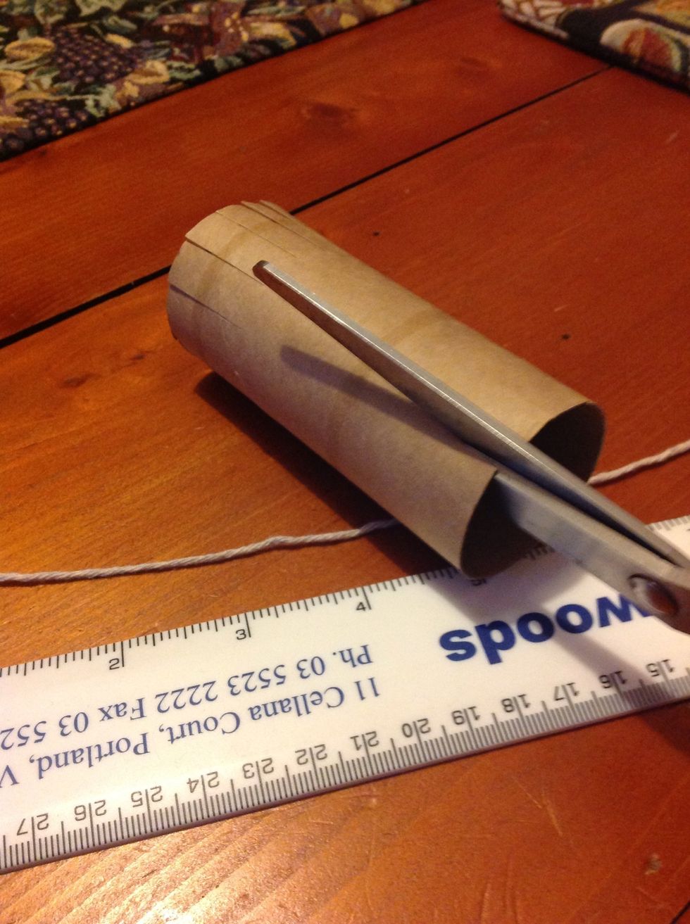 Now with the roll, cut along the edges on both sides like this: