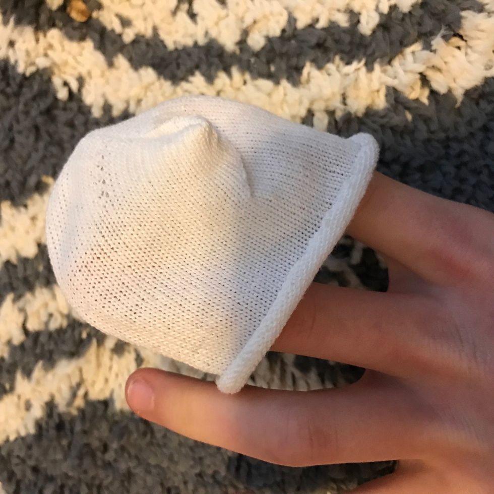 Now with your other sock cut the tip off to make a hat for your little snowman