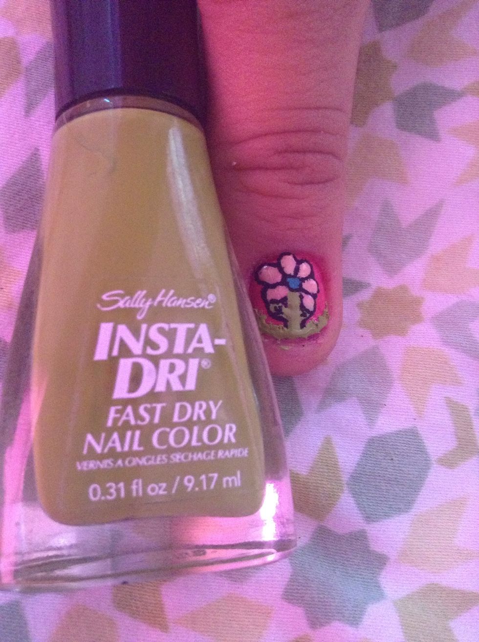 Now with your pin or dotting tool make a thin French tip at the tip of your nail and with something sharp drag it up as if your making grass ( witch you are )