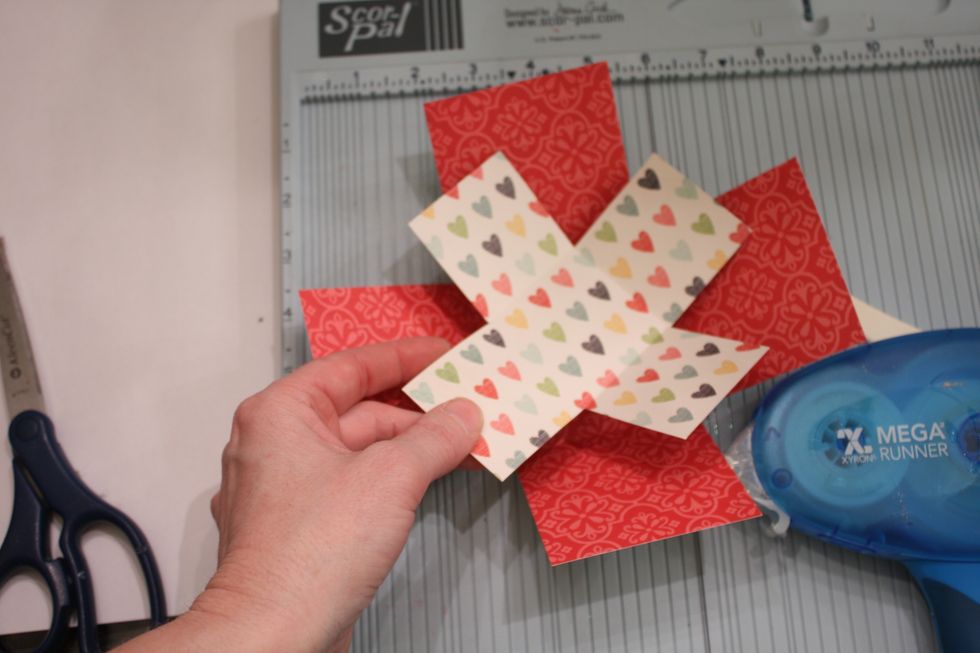 Now, with your tape runner attach the inside to the outer box, turning it at a diagonal angle. You can also line it up symmetrically if you like.