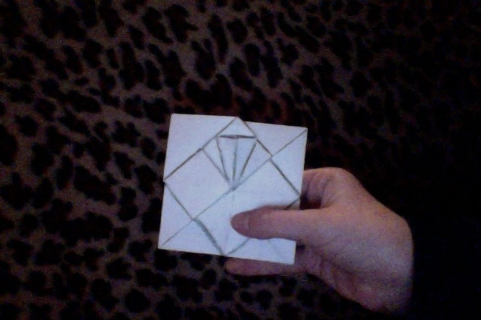 Now working with one small square, fold both sides in toward the center. Repeat on all squares.