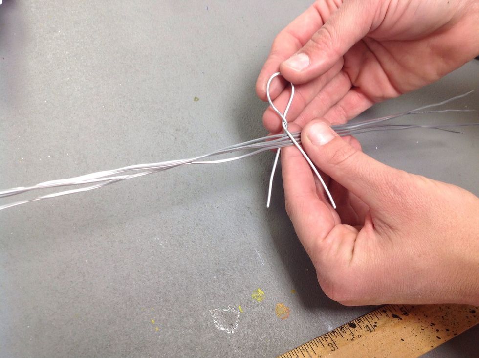 Now wrap around the center of all 4 of the other pieces of wire simultaneously.