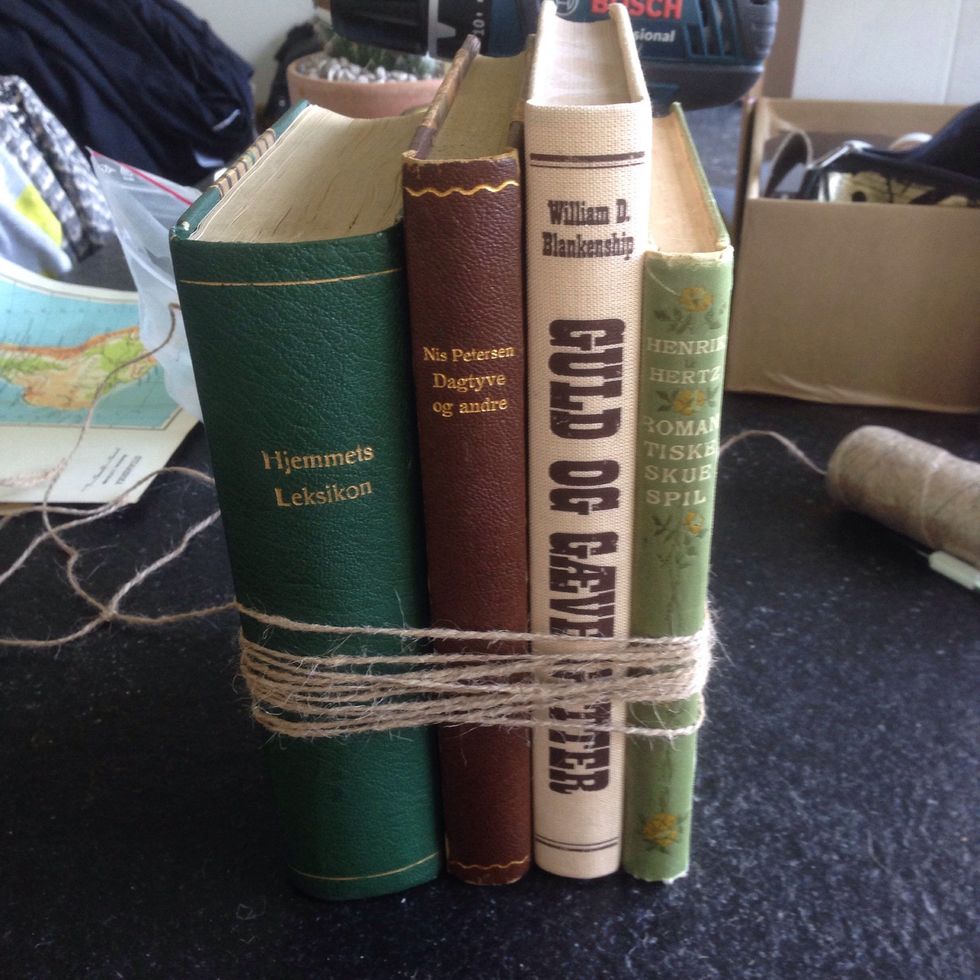 Now wrap plenty of twine around the books. As tight as possible