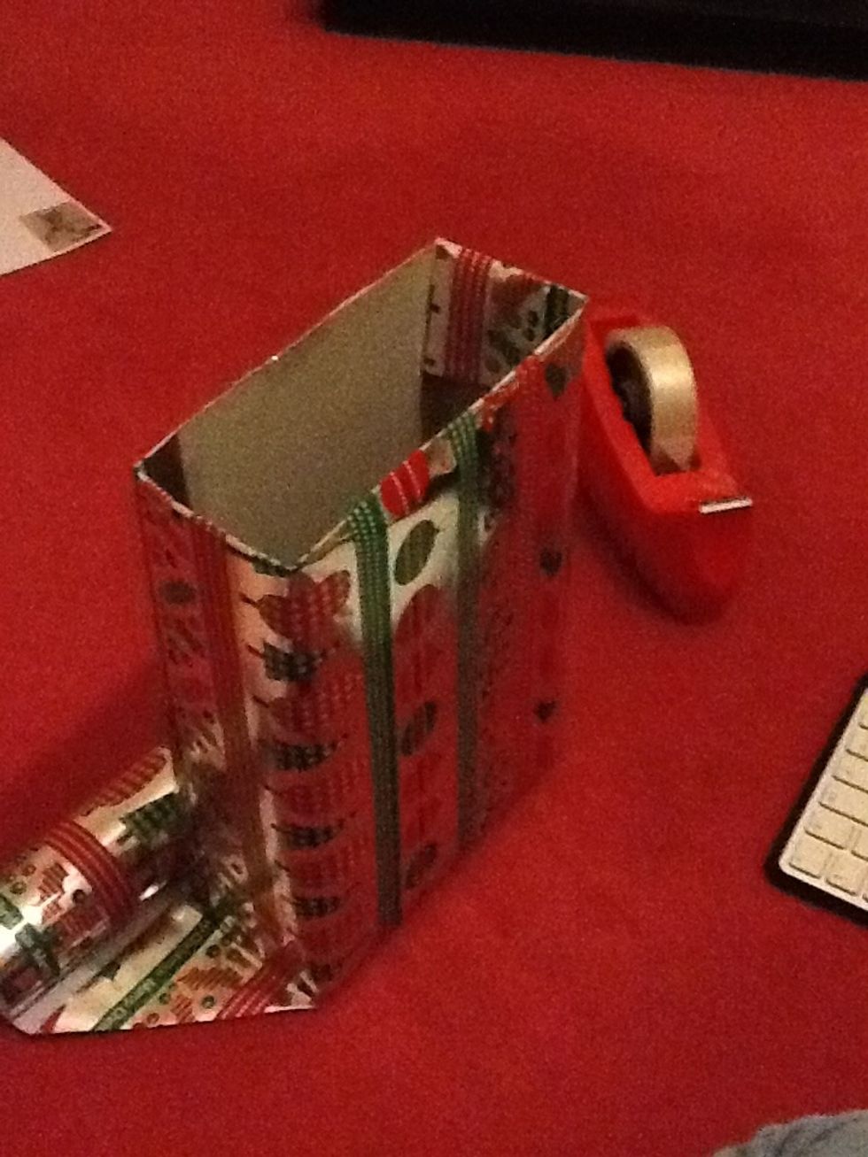 Now wrap your box like a present and don't make any folds or tape anything on the sides if you can, this will just make it look messy.