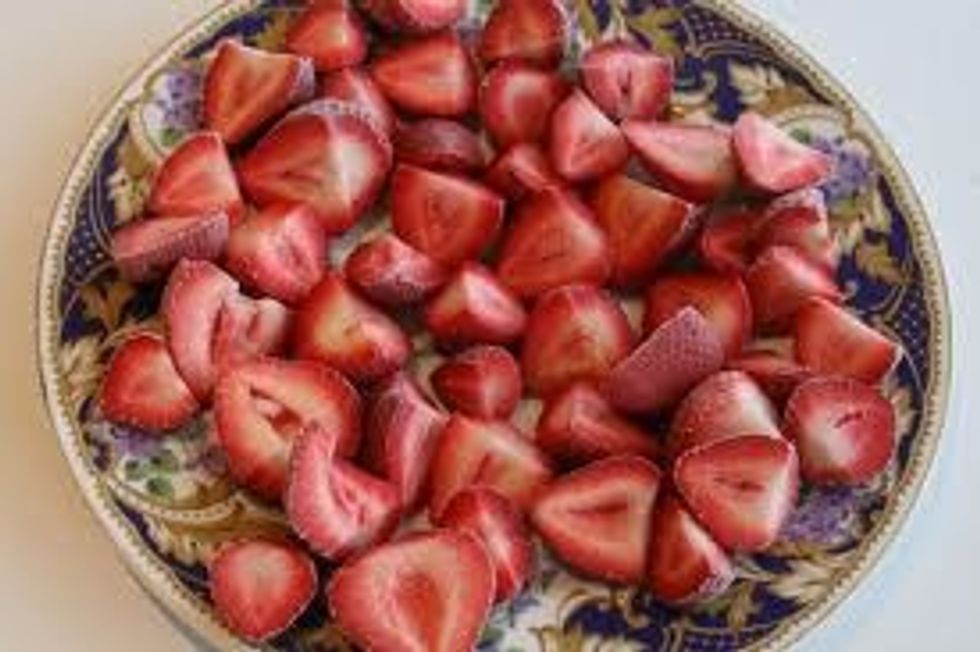 now you are going to get the strawberries and cut them in put the cut pieces in a plate or bowl