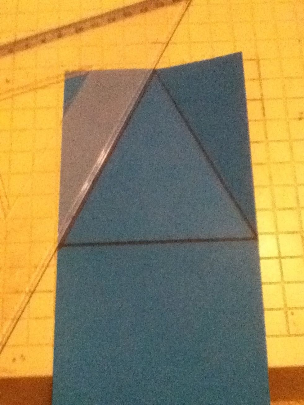 Now you are going to match up the middle pf the 4" side to the edge of the fold like a triangle and scor it