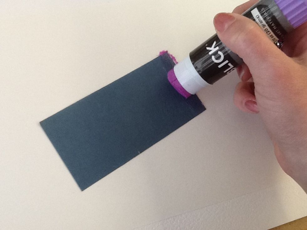 Now you are ready to add your flags!  Apply a thin strip of glue to the short edge...