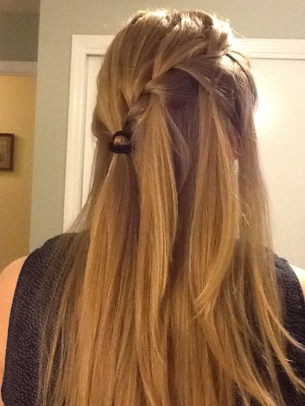Now, you can gather the hair into a ponytail and secure it with a hair band.