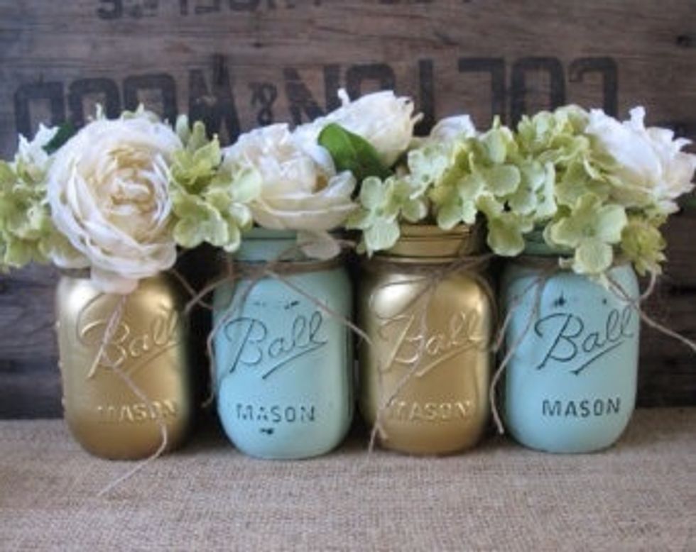 Now you can grab your fake flowers and cut the stem so they're smaller, and place them in your jar! Done! You can get as creative as you want with this.\ud83c\udf39