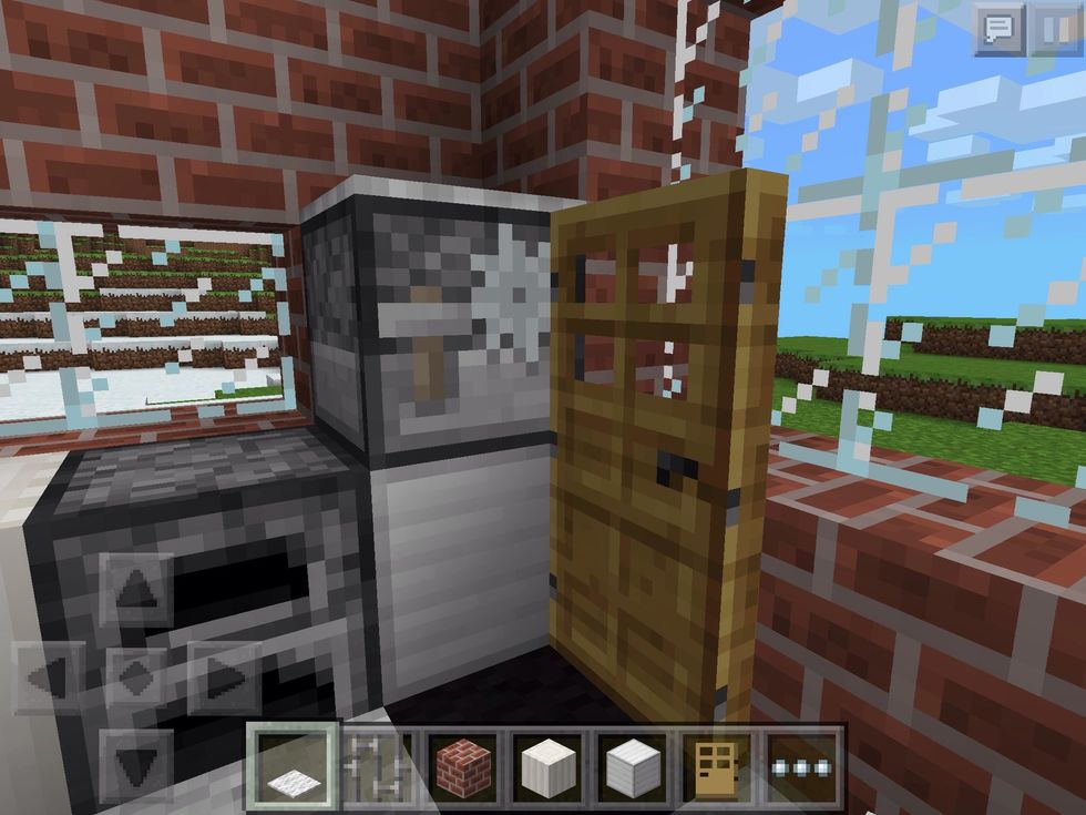 Now, you can "open" the door and build the rest of the fridge. I've used an iron block on the bottom and a stonecutter up top. (Any grey/dark blocks will work)