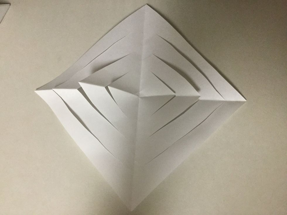 Now you can unfold your triangles. They should look like this picture.