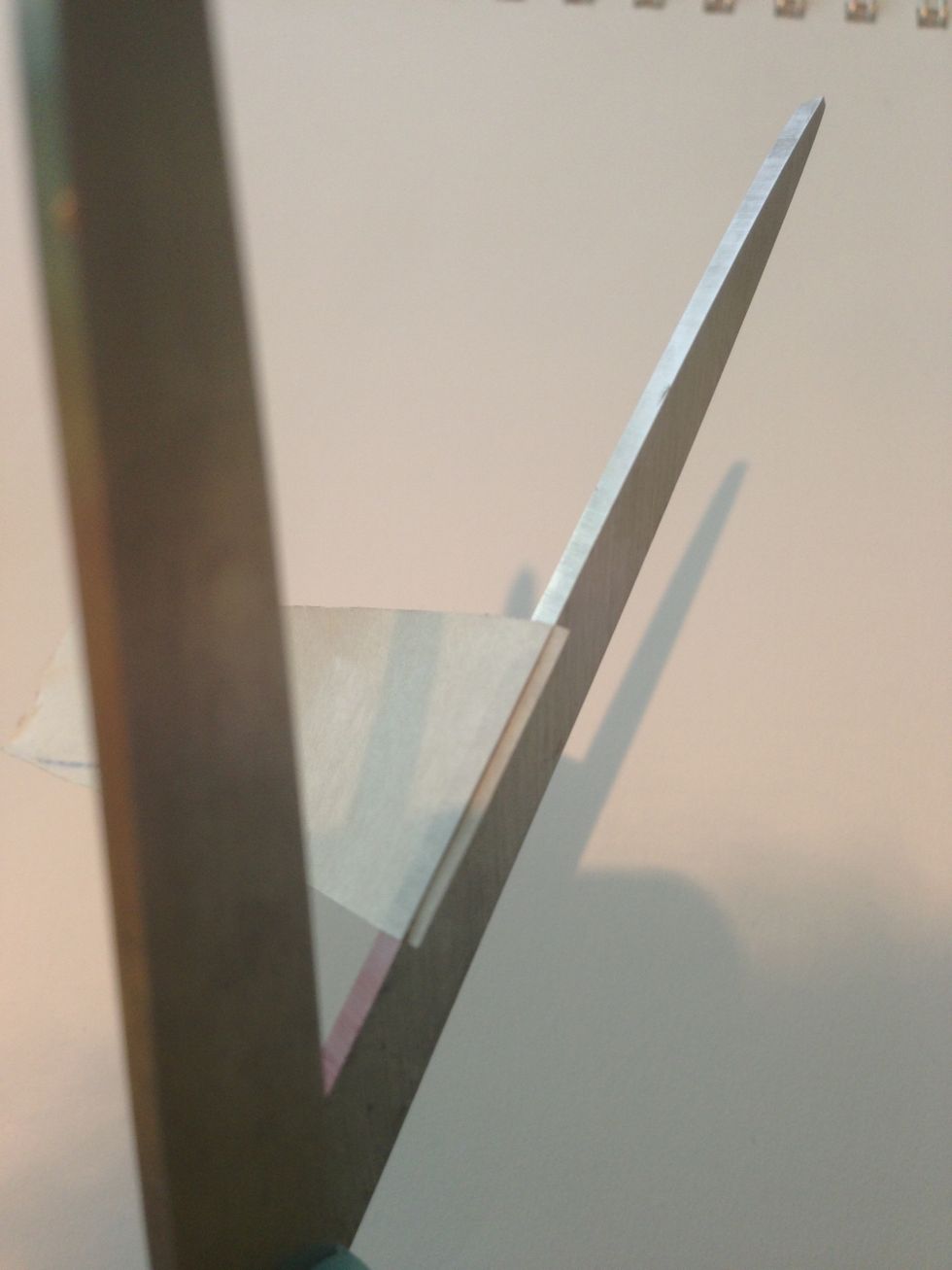 Now you cut it! It should look like this, although it may stick to the other blade. VERY CAREFULLY take the tape off.