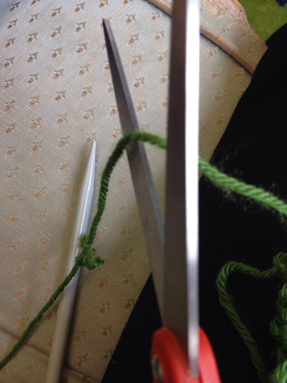 Now you cut the string like 3 inches from you ball of yarn