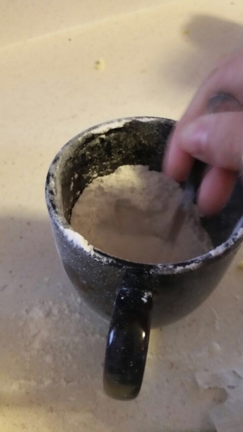 Now you fill a cup and a half of regular baking flour