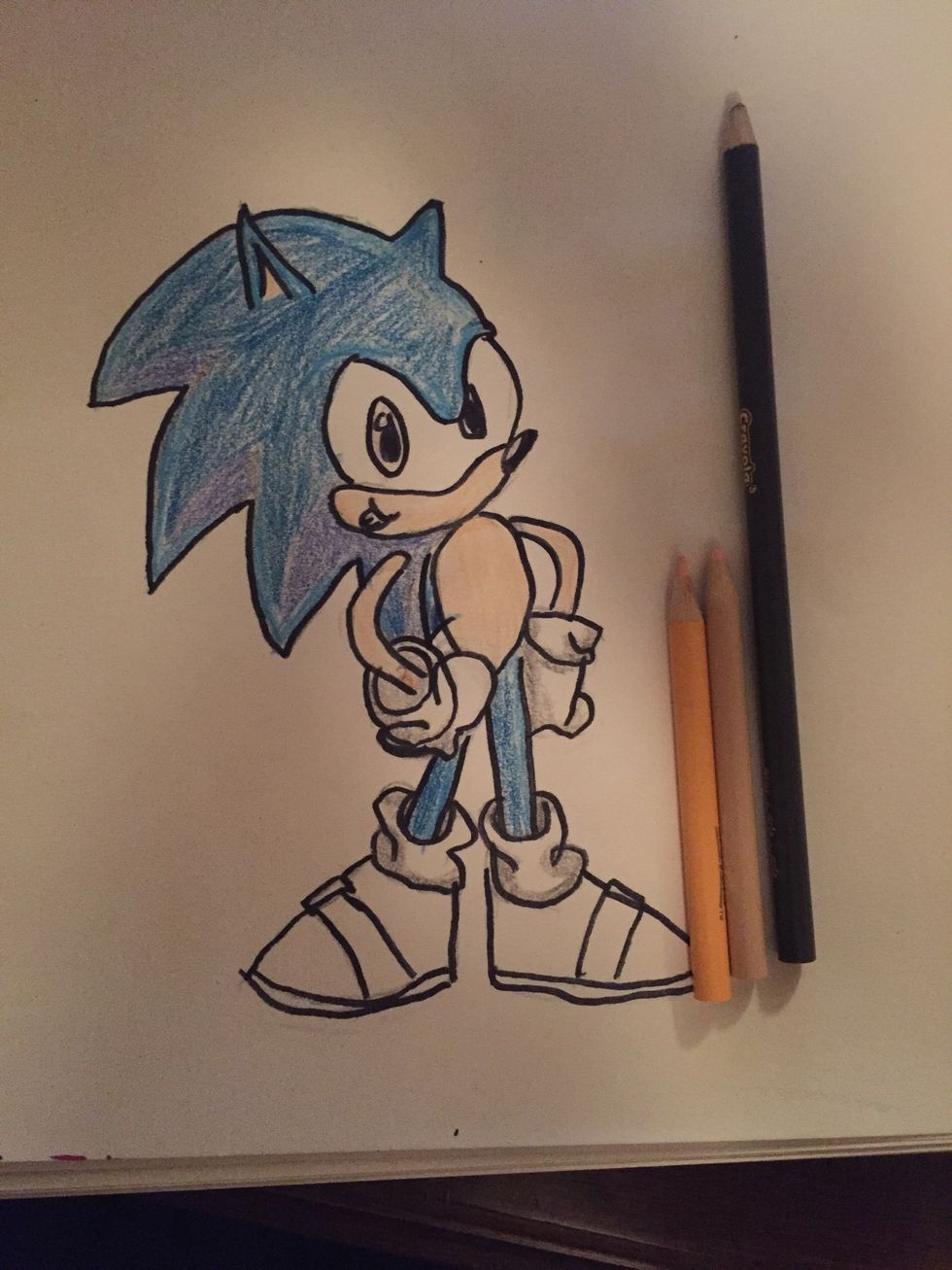 Now you get your peach and gray and lightly color his gloves gray then color peach on his arms, face, and stomach