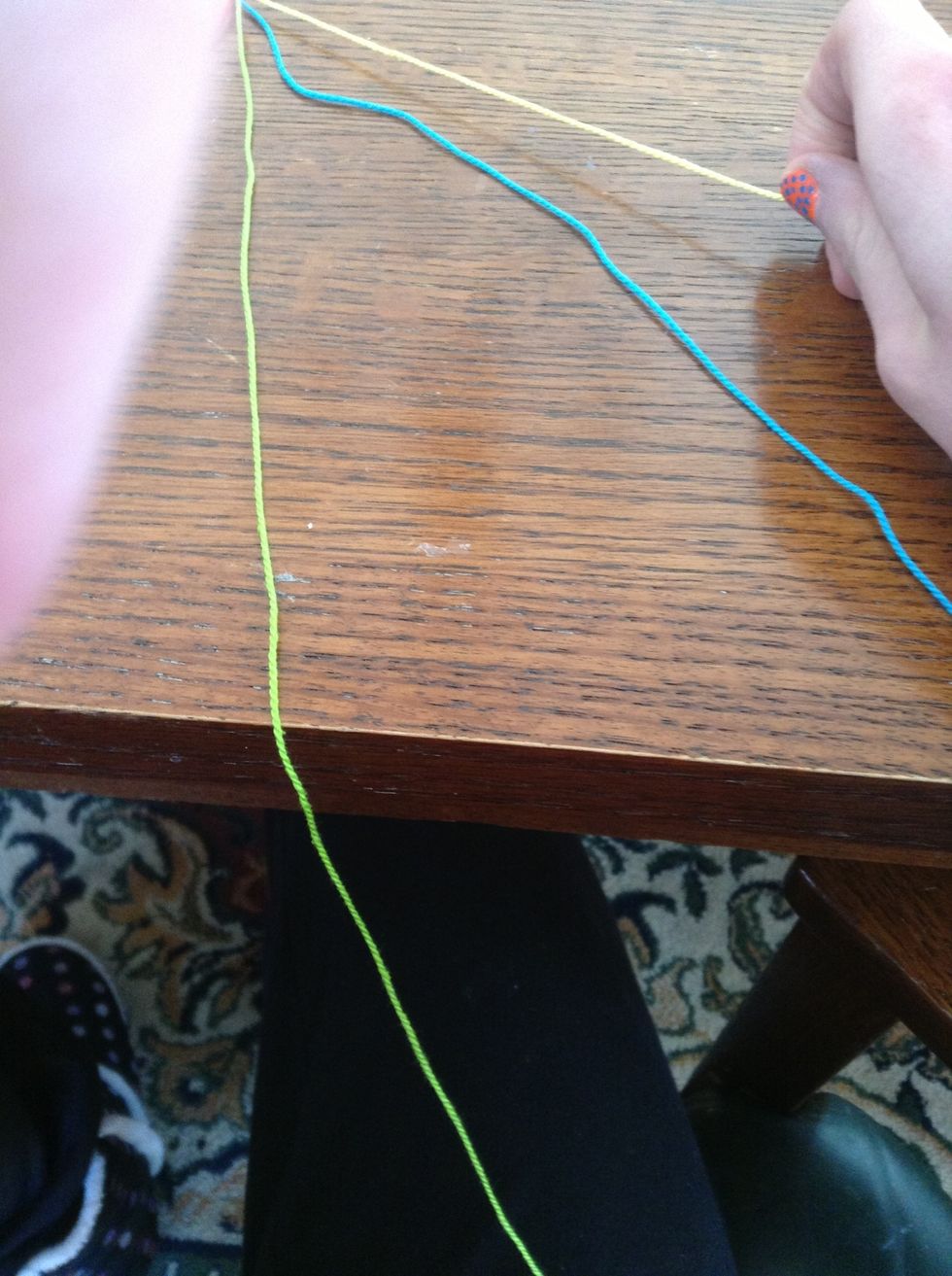 Now, you go over to the right side, and pick up the farthest string on the right. In my case, it was the yellow string.
