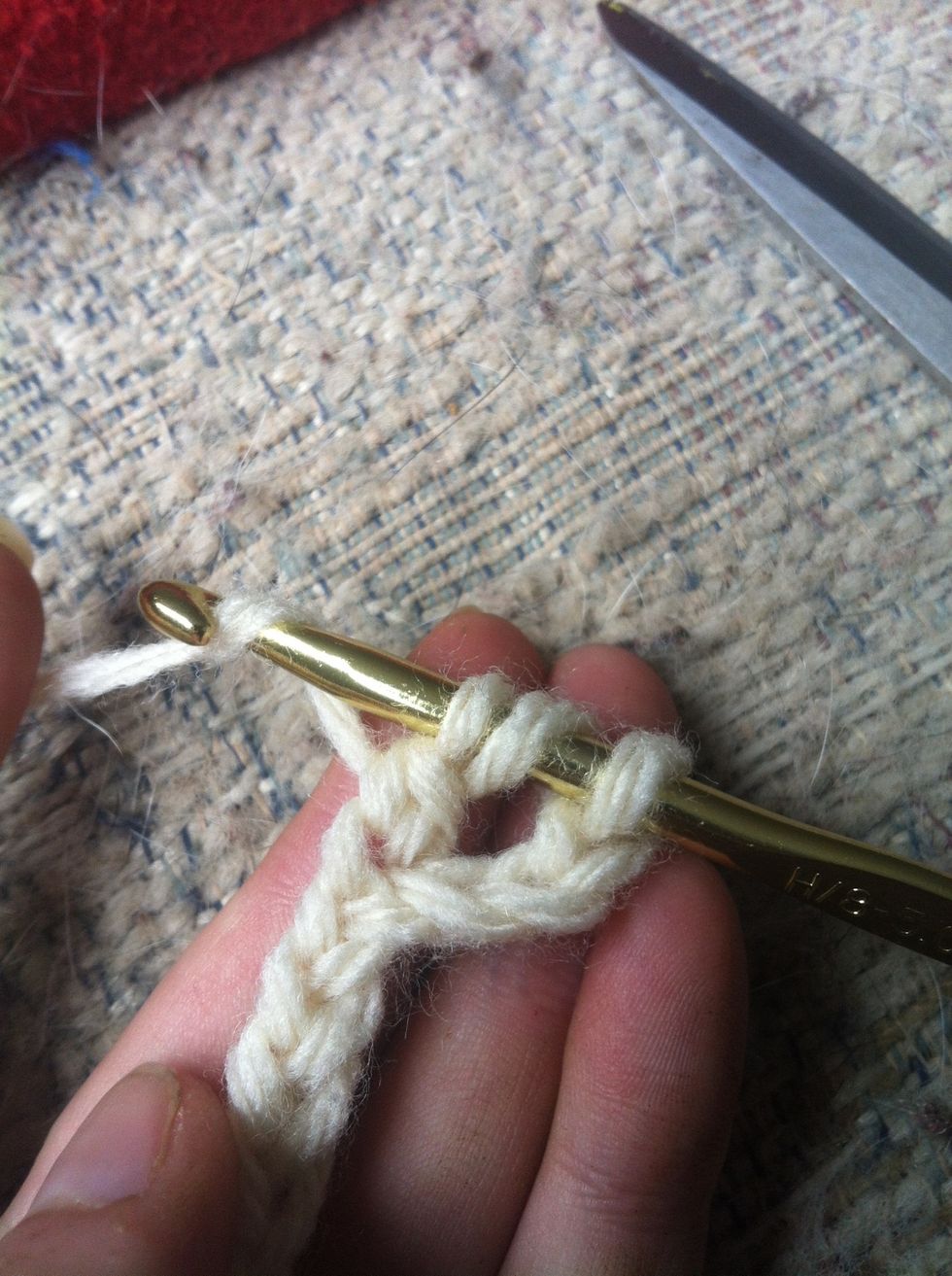 now you have 3 loops left. yarn around and pull through ALL 3 of them.