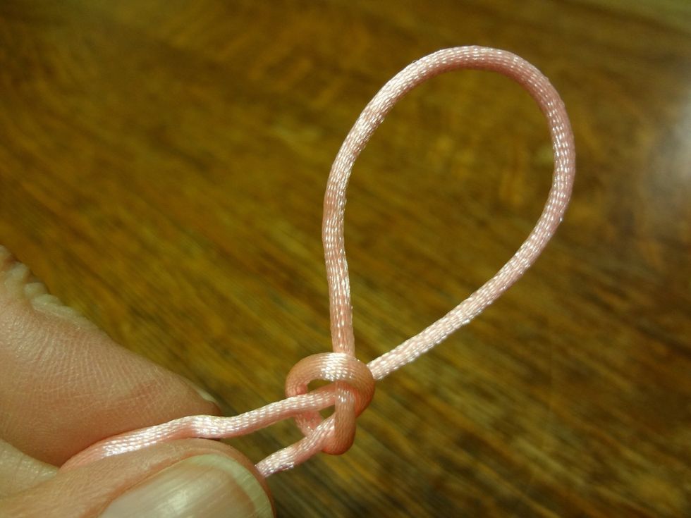Now you have a slip knot. This useful knot can be slipped over an object and tightened by pulling on one of the ends. To untie the knot, simply pull on one of the ends until the loop pulls through.