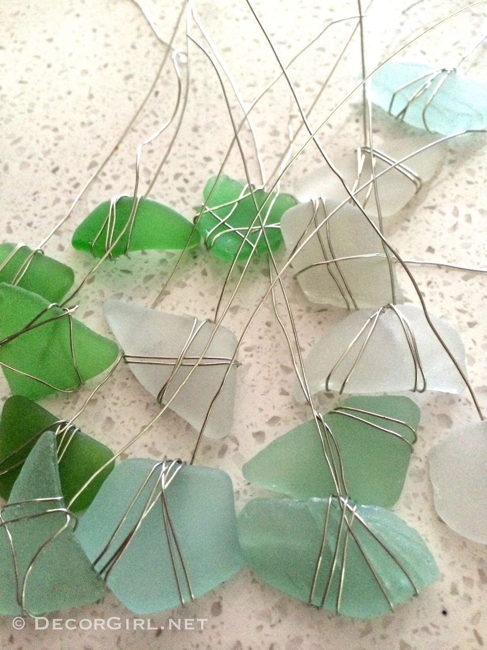 Now you have all your components ready for assembly.  Here we have three pieces, a piece of white, aqua and green sea glass to decorate each weight.