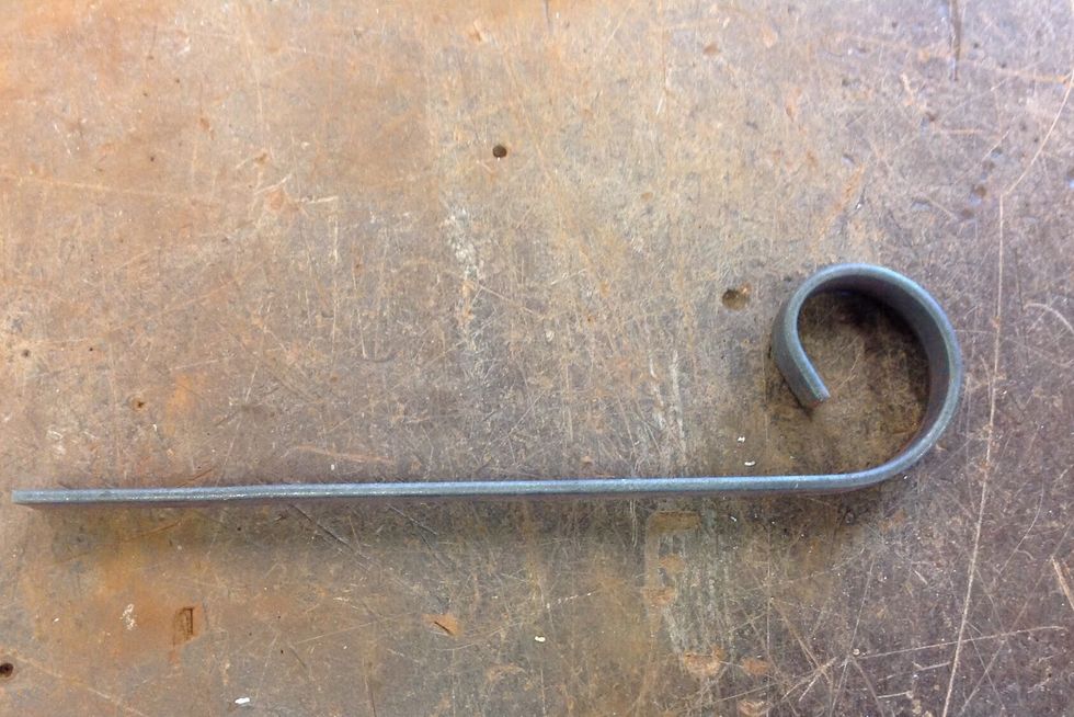 Now you have created your scroll. It should look like this. After you have created this use a ruler and scribe and measure 80mm and use the hacksaw to cut the feet out.