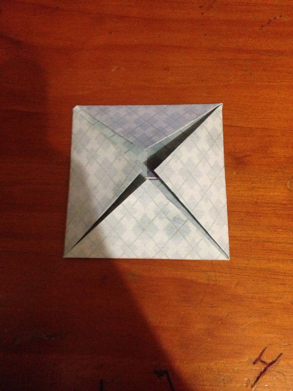 Now you have folded the corners into the centre twice for each corner