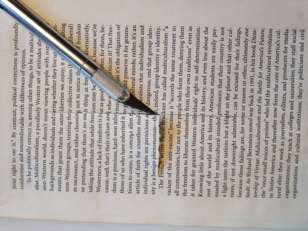 Now you have one or two pages that are covering the hole because they are glued to the outline. Start by cutting in the middle of these pages so you can work your way out to the edges.