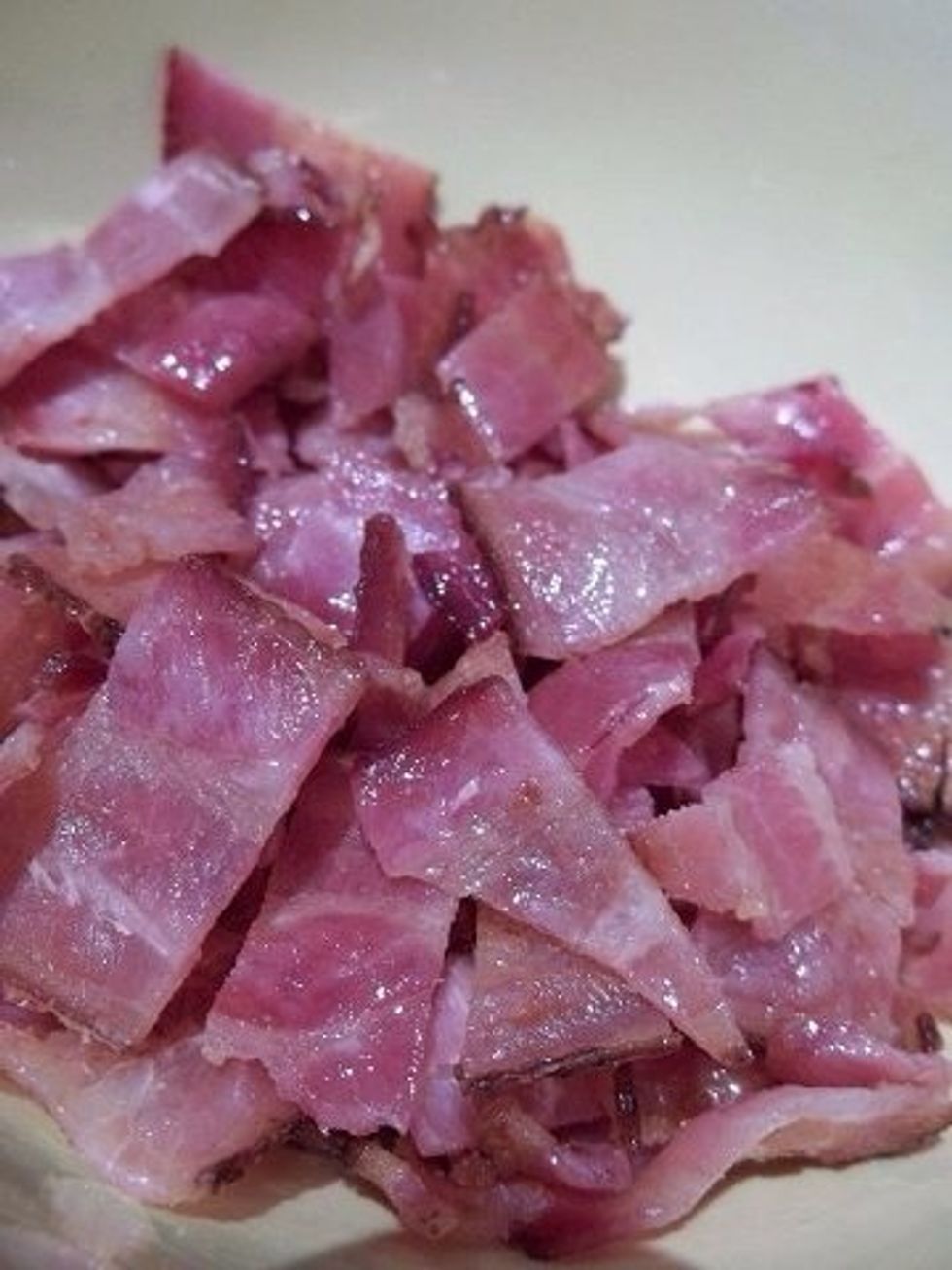 Now, you'll need to cut the bacon up. Place it in a bowl but take a small handful and save it for a nice little garish later.