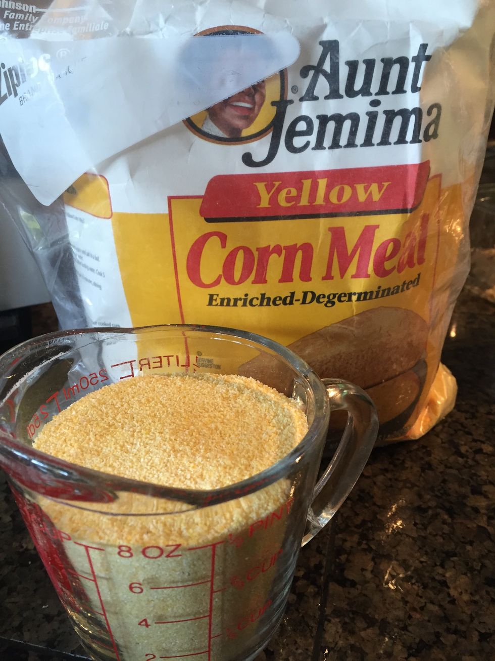 Now you need one cup of yellow cornmeal. I know this is not the right kind of measuring cup, but it will work.