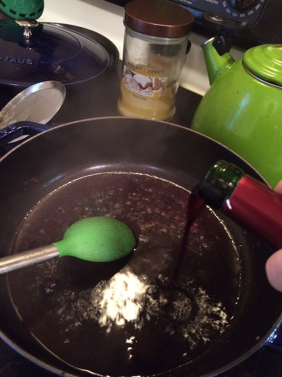 Now you need to deglaze the pan using 1 Cup of red wine or Beef Broth. Simply add your liquid to the pan and using your spoon, scrape up the browned bits that accumulated on the bottom of the pan.