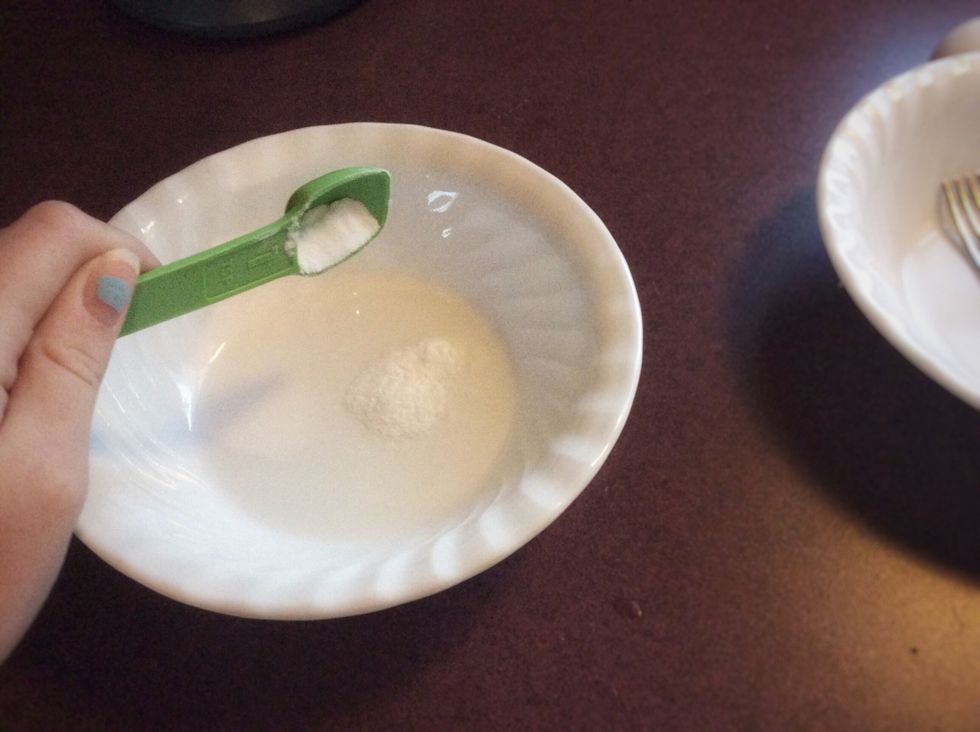 Now you need to get a small bowl and add a little water. Add 1 TSP of baking soda and mix it up. Do not add this to the large bowl yet. You should also at this time pre-heat your oven to 325.